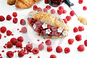 Delicious breakfast with fresh croissants and ripe berries