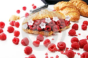 Delicious breakfast with fresh croissants and ripe berries