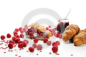 Delicious breakfast with fresh croissants and ripe berries