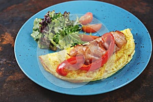 Delicious breakfast. Fried omlette with sliced ham