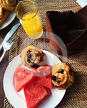 Delicious Breakfast with watermelon juice and croissants