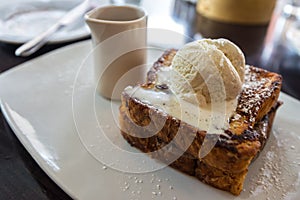 Delicious brioche bread french toast topped with ice cream