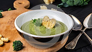 Delicious broccoli cream soup. Healthy vegetarian food. Vegan menu. Food recipe background. Close up