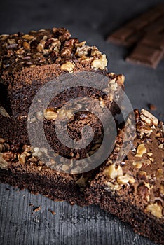 Stack of homemade brownies cake with a lot of walnuts