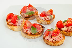 Delicious bruschetta (Italian Toasted Garlic Bread ) with ham and cherry tomato