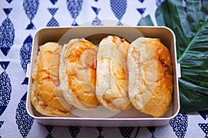 Delicious bun make Natural yeast with cream filling on box.