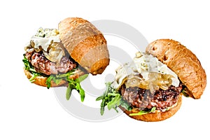 Delicious burgers with blue cheese, marbled beef, onion marmalade and arugula . Isolated on white background.