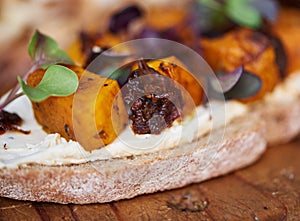 Delicious butternut and beet open faced sandwich on a board