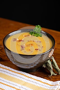 Delicious butternut squash soup with bacon bits