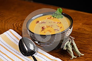 Delicious butternut squash soup with bacon bits