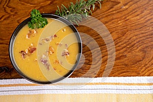 Delicious butternut squash soup with bacon bits