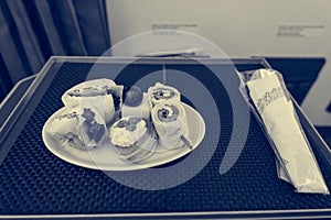 Delicious canape finger food appetizers served on airplane business class seats.