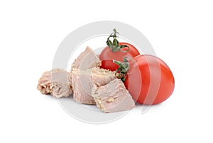 Delicious canned tuna chunks with tomatoes on white background