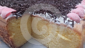 Delicious caramel chocolate tart. Desert tart chocolate. Chocolate tart with salted caramel, decorated with pieces of fresh strawb
