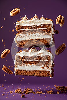Delicious Carrot Cake Slice with Cream Cheese Frosting and Flying Pecans on a Purple Background
