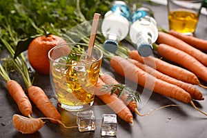 Delicious carrot and mandarin cocktail with ice