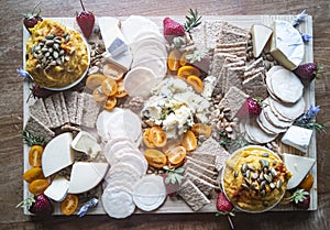 Delicious cheese and crackers food platter board