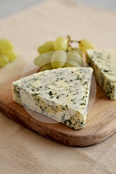 Delicious Cheese Danablu on a wooden board, side view