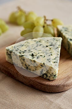 Delicious Cheese Danablu on a wooden board, side view