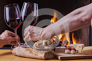 Delicious cheese and wine at the fireplace