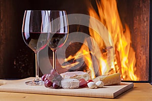 Delicious cheese and wine at the fireplace