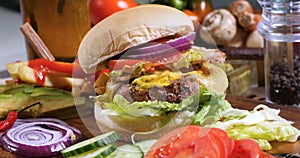 A delicious cheeseburger with bacon and guacamole photo