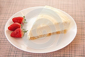 Delicious cheesecake with strawberries on  plate