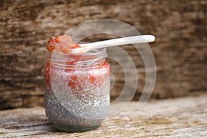Delicious chia pudding spoon with rharbarber compote