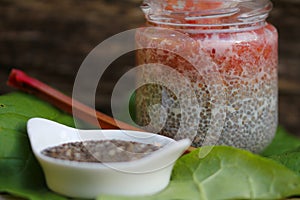 Delicious chia pudding spoon with rharbarber compote