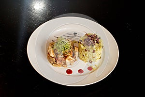 Delicious Chicken Ambre with Rice and Onion Sprouds photo