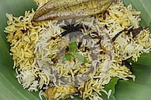 Delicious chicken biryani top view.Biryani rice dish Beautiful Indian rice dish.Delicious spicy chicken biryani in bowl over moody