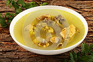 Delicious chicken broth with herbs and spices.