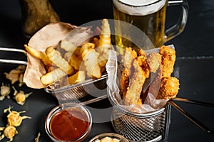 delicious chicken fingers served with french fries and beer at local pub