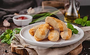 Delicious chicken nuggets on a white plate food photography