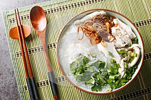 Delicious chicken soup with glass noodles mien ga is a Vietnamese dish that is guaranteed to comfort closeup on the bowl.