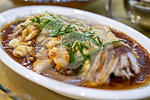 A delicious Chinese dish, steamed sea bass fillets