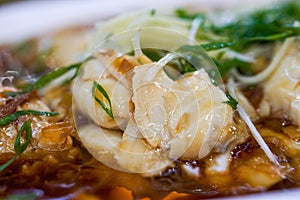A delicious Chinese dish, steamed sea bass fillets