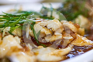 A delicious Chinese dish, steamed sea bass fillets