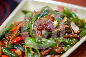 A delicious Chinese Hunan dish, stir-fried pork with chili