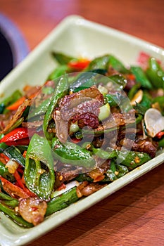 A delicious Chinese Hunan dish, stir-fried pork with chili