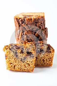 Delicious chocolate banana cake on white background.