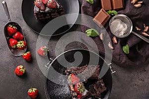 Delicious chocolate cake with berries on grey table