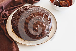 Delicious chocolate cake brownie with cherries on white wooden table