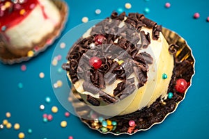 Delicious chocolate cake closeup on blue background
