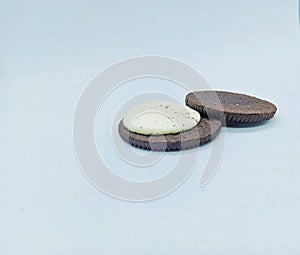 Delicious chocolate craker with white cream on a white background