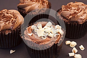 Delicious chocolate cupcakes with white chocolate curls