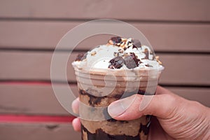 A delicious chocolate frappe in plastic cup