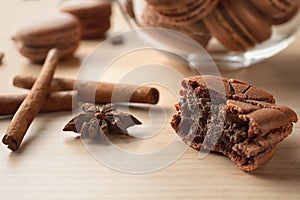 Delicious chocolate macaron on table