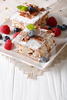 Delicious chocolate millefeuille with raspberry and blueberry cl