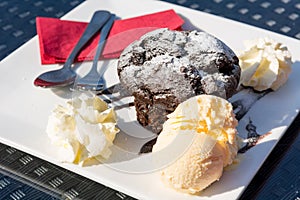 Delicious chocolate muffin served with vanilla ice cream.